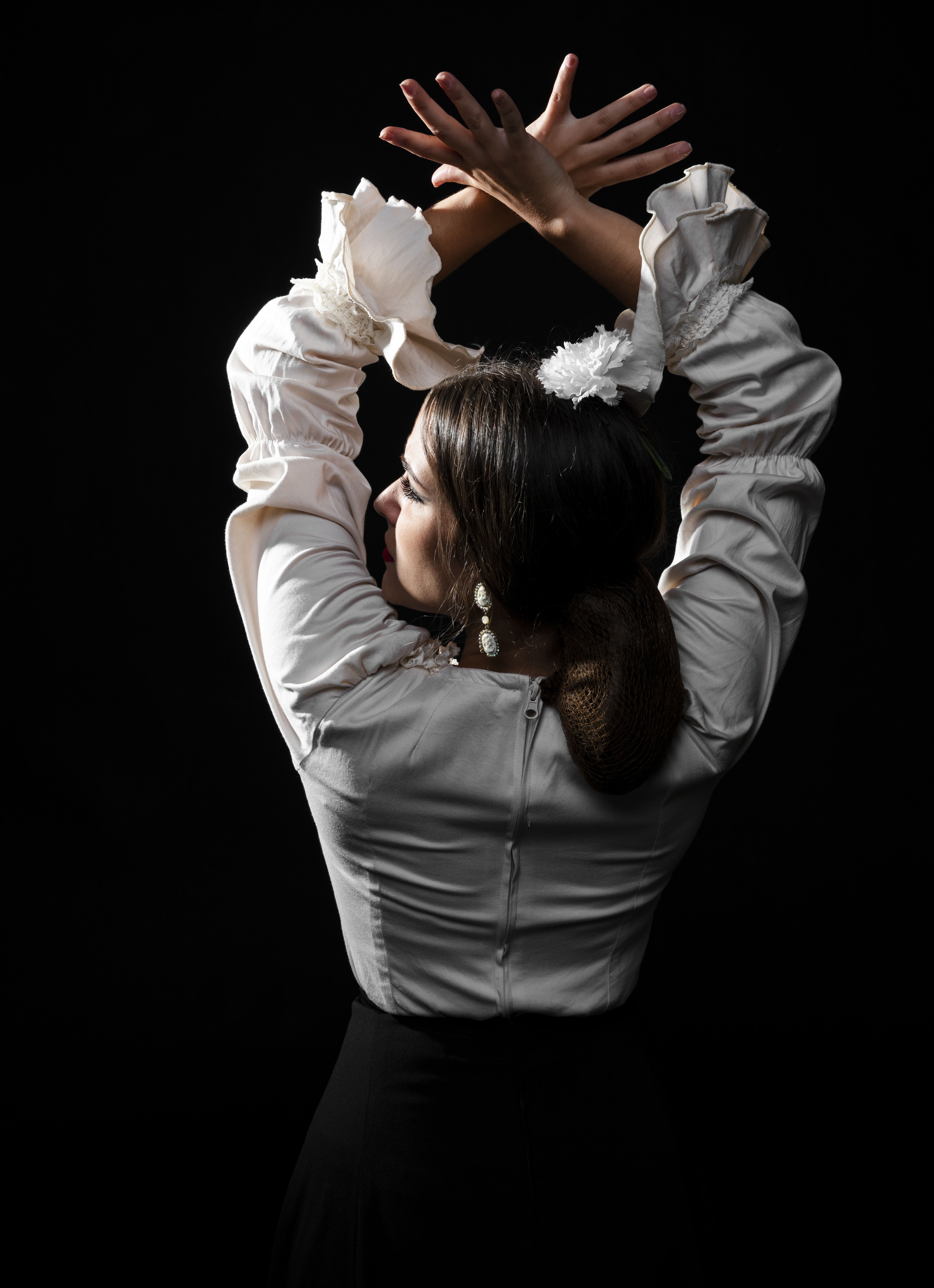back-view-flamenco-dancer-raising-hands