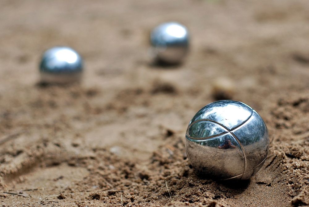 Petanque on sand. Free public domain CC0 image.

More:

 View public domain image source <a href=