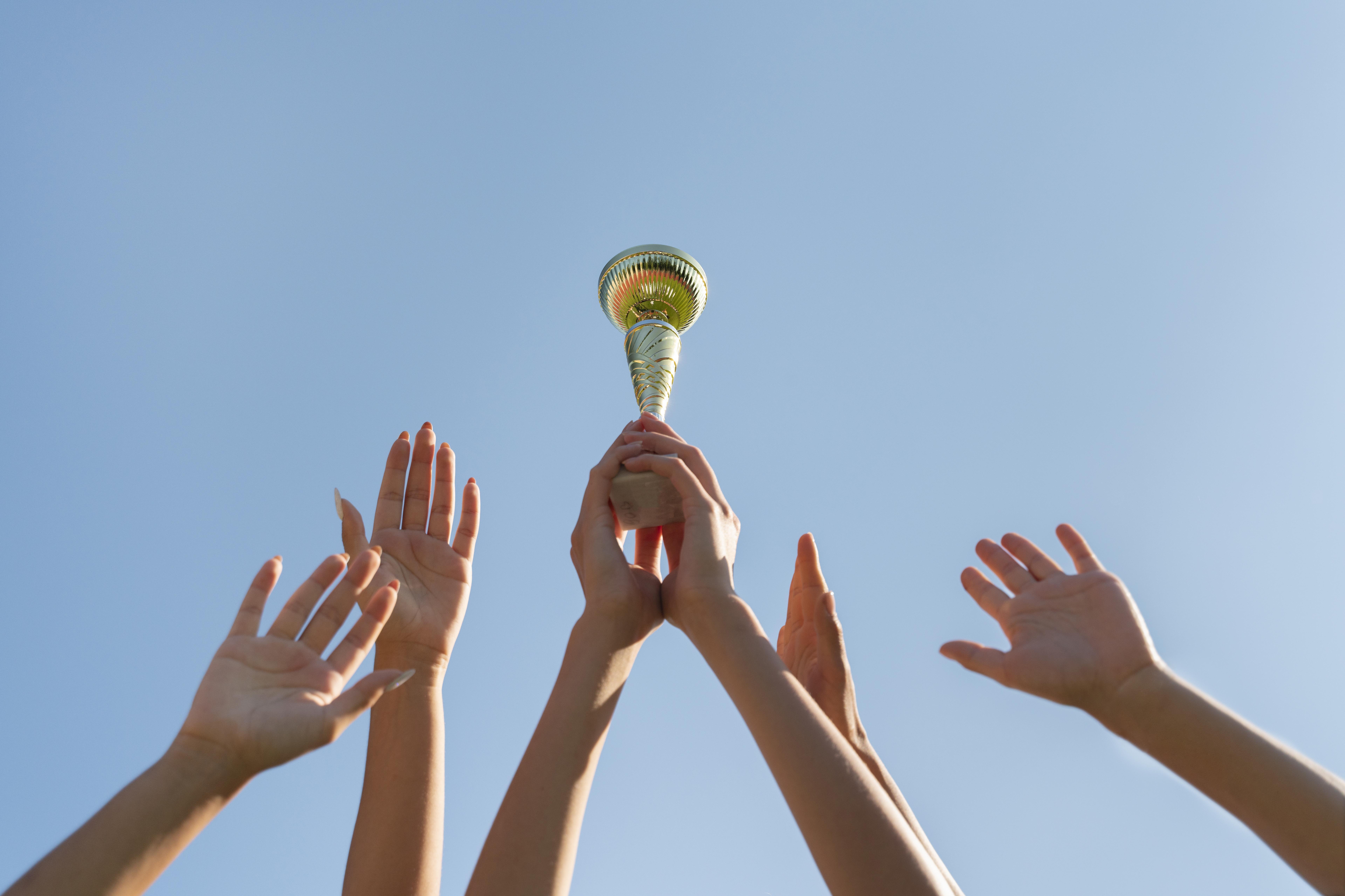young-women-holding-sports-cup